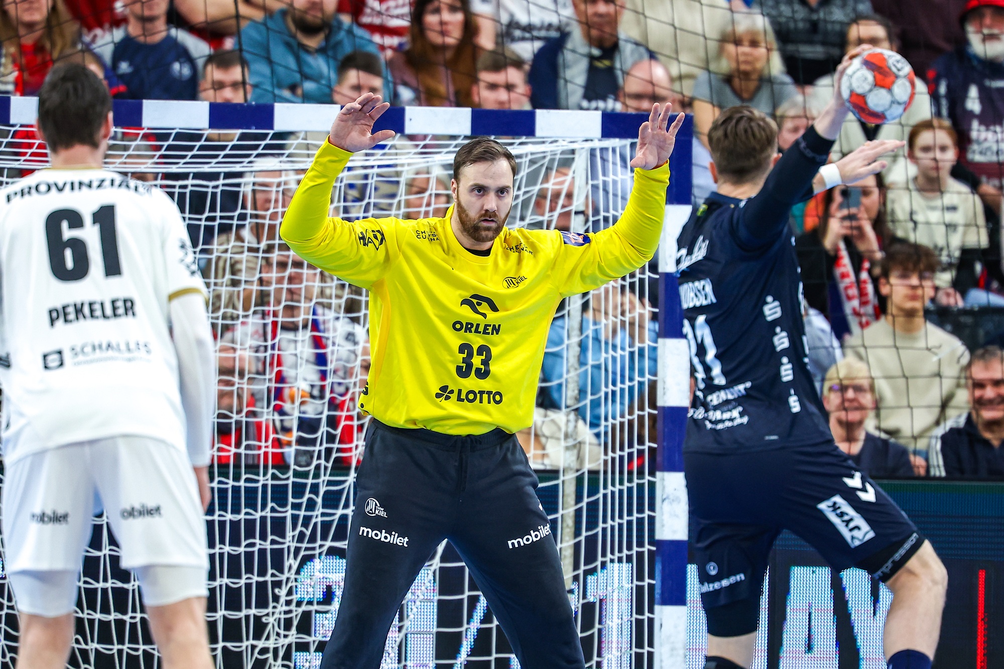 Kiel beat Flensburg on tense opening night of main round